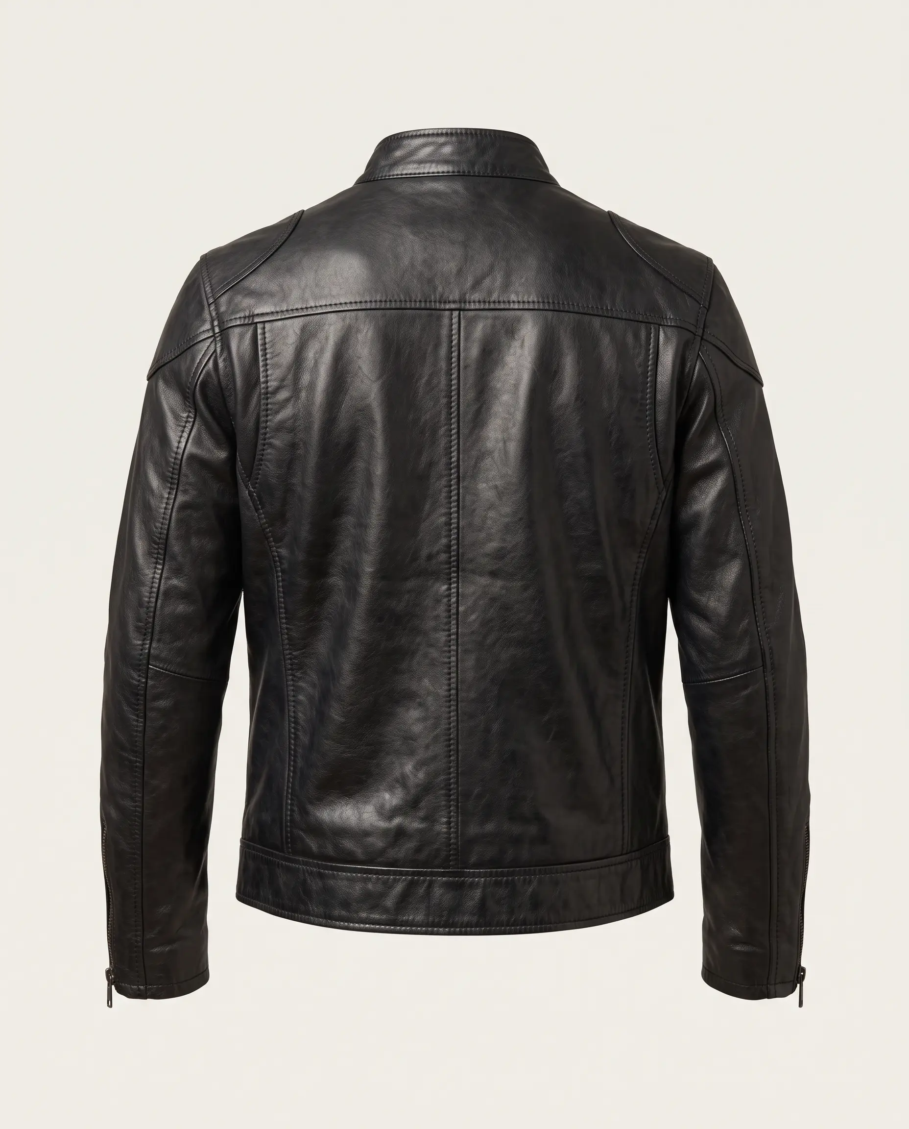 Back view of men's vintage black café racer leather jacket showing shoulder yoke, action-pleat shoulder gussets, paneled stitching, and a stitched waistband on a plain studio background – Roaming Lifestyle